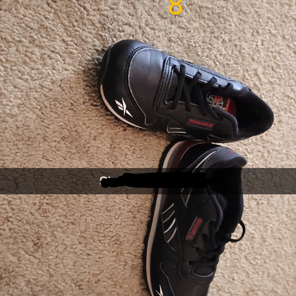 Reebok Black Sneakers with Red Accents and Mesh Design